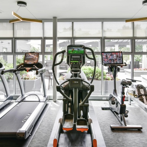 Cutting-edge amenities at your fingertips a gym with exercise equipment