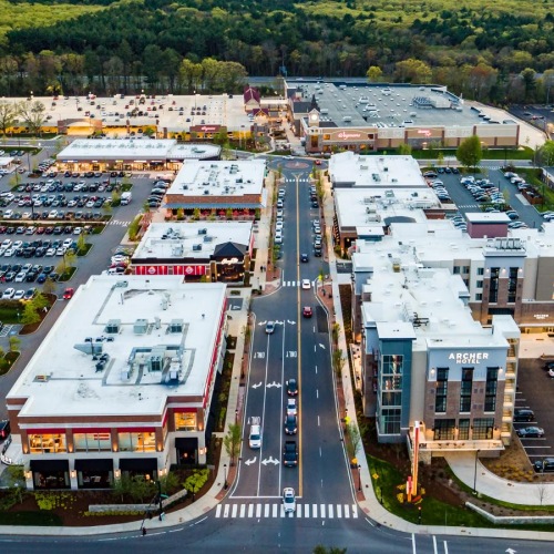 Find your perfect fit at The Huntington a large building with a parking lot