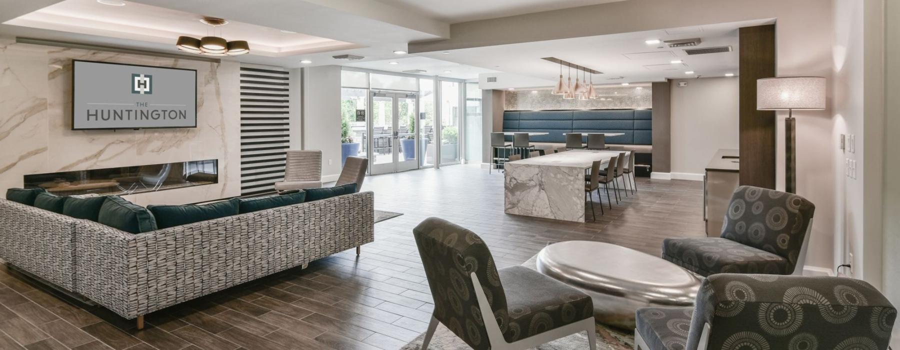 a living room with a large glass door and a large dining table