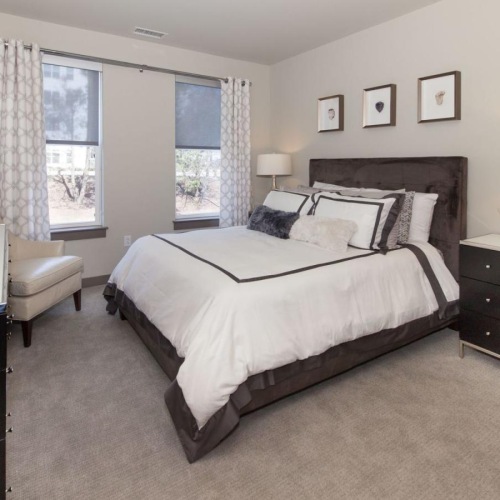 Beautiful bedrooms to fit every need a bedroom with a bed and a mirror